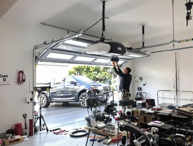 Temescal Valley Garage Door Repair specialist installing smart garage door opener system in Temescal Valley home
