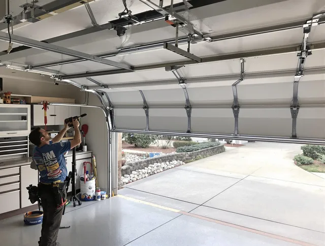 Garage door track repair service by Temescal Valley Garage Door Repair in Temescal Valley